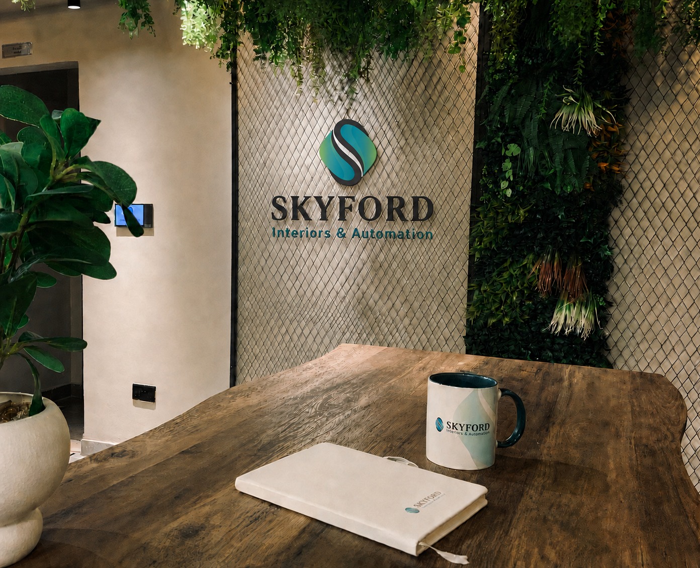 Skyford Interiors & Automation logo signage on a textured feature wall in a branded reception area